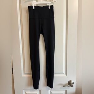 Lululemon wonder train high rise tight in black.